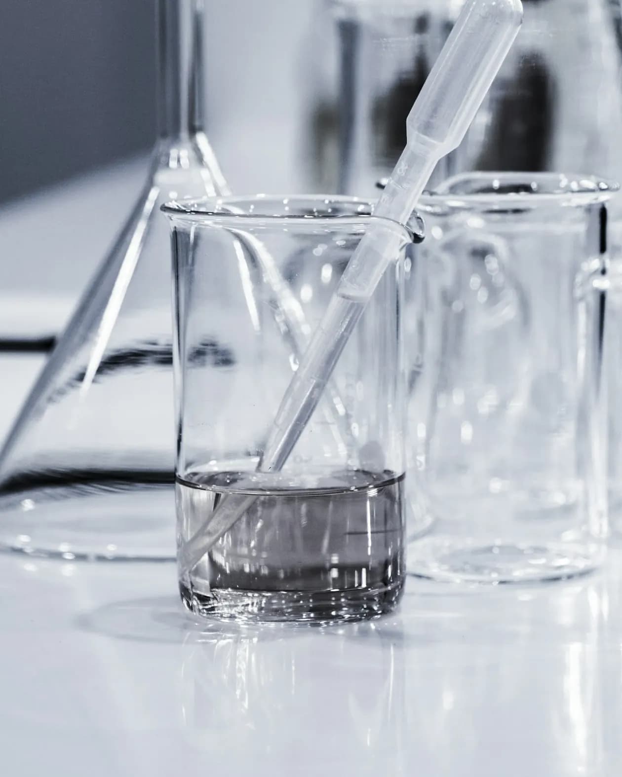 Laboratory glassware with a pipette in a beaker