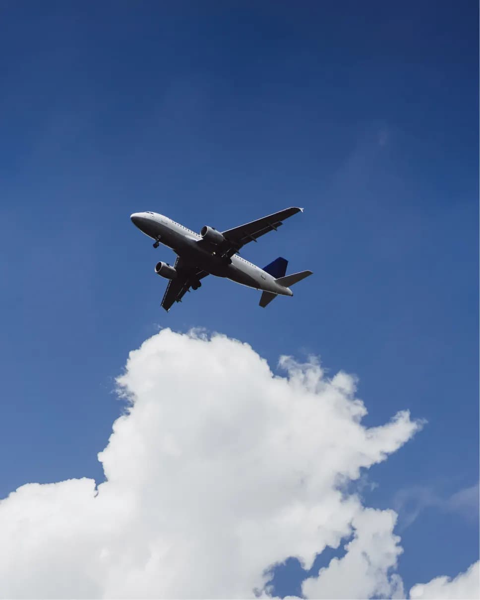 Aircraft in flight above clouds
